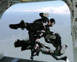 British parachutists jump into air